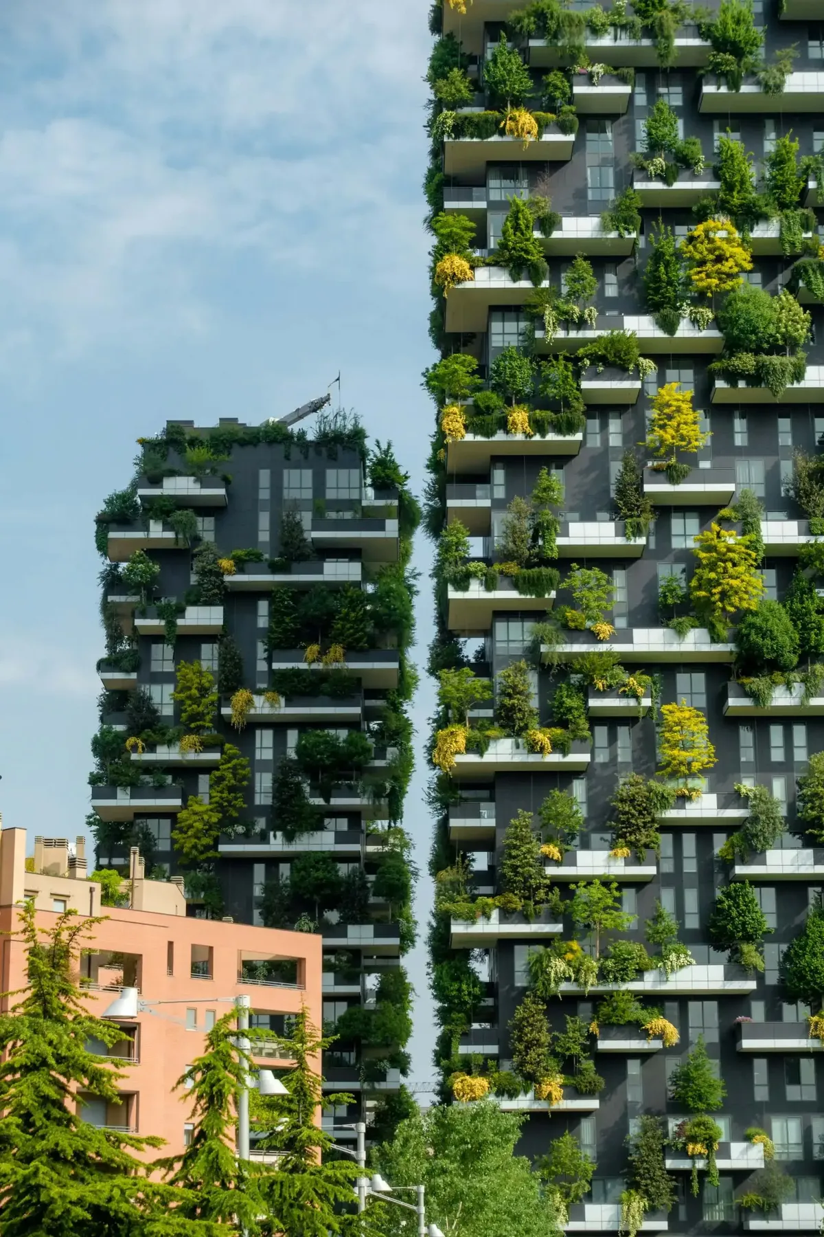 Bosco Verticale in Milano representing the city's luxury boom and the executive opportunities created by UHNWI demand